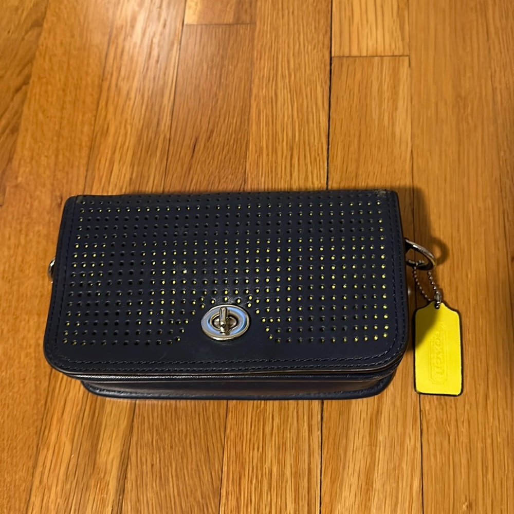 Navy blue and neon yellow Coach crossbody